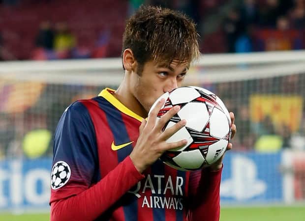 Barcelona's Neymar kisses the ball after scoring a hat-trick against Celtic as he leaves the pitch at the end of their Champions League soccer match in Barcelona