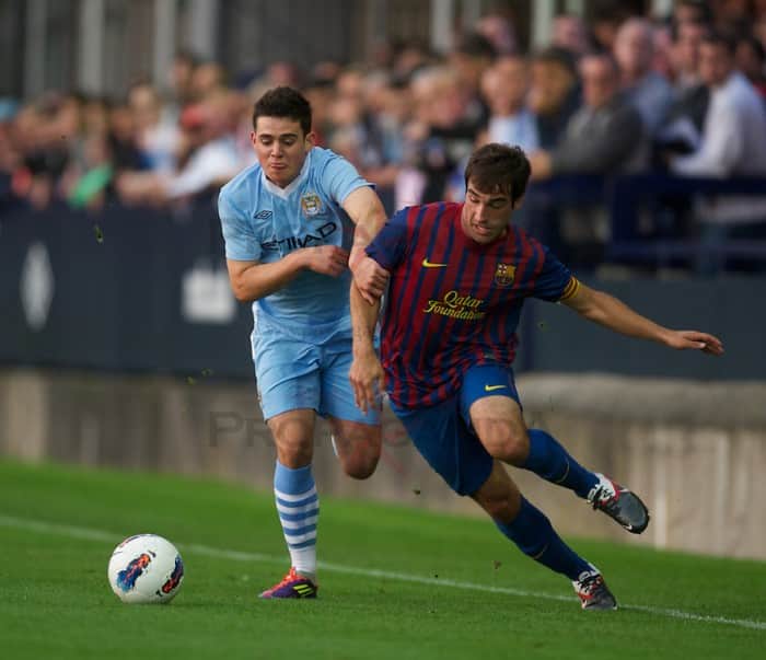HYDE, ENGLAND - Thursday, September 15, 2011: Manchester City's Joan Angel Roman and FC Barcelona's Eduard Campabadal during the NextGen Series Group 1 match at Ewen Fields. (Pic by David Rawcliffe/Propaganda)